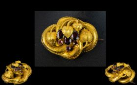 A Victorian 18ct Gold And Garnet Set Love Knot Brooch Yellow brushed gold brooch with pin back