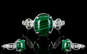 Malachite and White Topaz Ring, an oval cut cabochon of 6cts, of the naturally striated malachite,