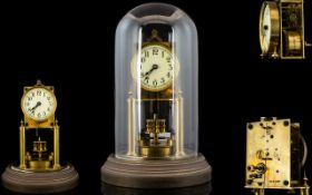 Gustav Becker Spring Driven Rotating Disc Pendulum 400 Day Anniversary Clock under a heavy glass