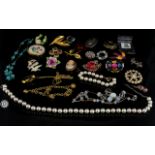 A Collection Of Costume Jewellery Large segmented box containing various paste set brooches,