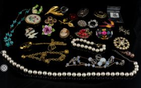 A Collection Of Costume Jewellery Large segmented box containing various paste set brooches,