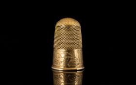18ct Gold Thimble with Honey Comb Top with Chased Decoration Below.