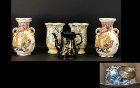 A Large Collection Of Pottery To include a pair of Japanese vases with gilt trim,