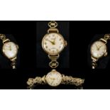 Accurist - Swiss Made Ladies 9ct Gold Mechanical Wrist Watch.