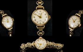 Accurist - Swiss Made Ladies 9ct Gold Mechanical Wrist Watch.