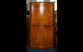 J Webster And Sons Ltd Yew Wood Drinks Cabinet Corner cabinet with serpentine front, panelled doors,