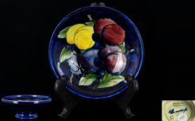 William Moorcroft Signed Small Footed Bowl Wisteria 'Plums' Design. Circa 1920s.