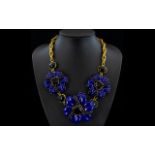 Blue-Violet and Black Floral Statement Necklace comprising three large blue-violet lucite style