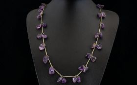 A Vintage Amethyst Necklace Long pewter tone necklace set with multiple, organic form polished