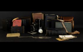 A Box Containing A Mixed Quantity Of Books Cameras And Ephemera To include two autograph books,