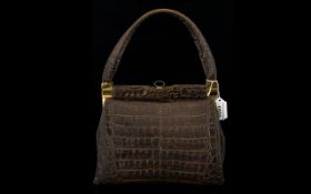 A Vintage Crocodile Handbag Brown exotic skin top handle 1970's bag with gold hardware,