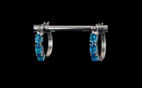 Neon Apatite Hoop Earrings, three oval cuts of the rarest and brightest of the apatite stones,