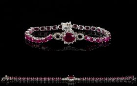 Ruby and White Topaz Accent Bracelet, the central motif comprising a 3.