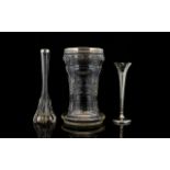 A Cut Glass And Silver Vase Wide trumpet form vase with star base and silver rim, hallmarked,