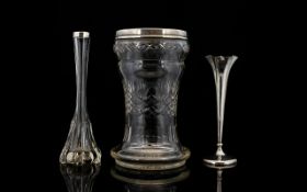A Cut Glass And Silver Vase Wide trumpet form vase with star base and silver rim, hallmarked,