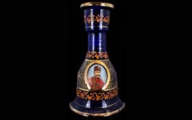 A Blue Glass Mallet Shaped Decanter With applied gilt decoration and portrait of Ottoman soldier
