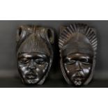 Two Carved Wood Wall Masks Ebonised wood