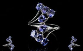 Tanzanite Crossover Ring, 3cts of oval c