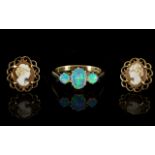 A 9ct Gold And Synthetic Opal Dress Ring Fully hallmarked to inner shank, 375 for 9ct gold,