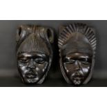 Two Carved Wood Wall Masks Ebonised wood masks, each hand carved with hook to back for wall
