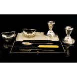 A Collection Of Silver Items to include a pair of squat silver candle sticks of plain form,