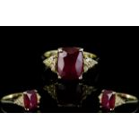 Ruby Solitaire and White Topaz Accents Ring, a 4.25ct elongated cushion cut ruby accented to