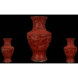 Antique Chinese Cinnabar Vase Lacquered floral design with figures, some damage, height 6¼ inches,