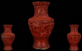 Antique Chinese Cinnabar Vase Lacquered floral design with figures, some damage, height 6¼ inches,
