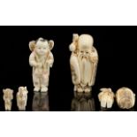 A Pair Of Carved Netsuke The first in the form of a sage in traditional robes,