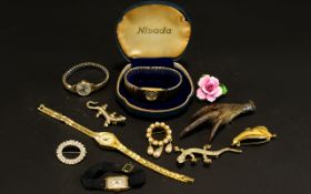 A Collection Of Costume Jewellery A varied lot to include 1920's cocktail watch with black