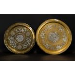 Two Antique Islamic Brass Chargers Each with inlaid silver script, diameters 18 and 16 inches.