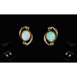 Ladies - Good Quality and Pleasing Pair of Opal and Diamond Earrings - Set In 9ct Gold.
