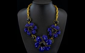 Blue-Violet and Black Floral Statement Necklace comprising three large blue-violet lucite style