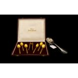 Silver Slotted Spoon & Cased set of Gilt Spoons & Sugar Tongs.