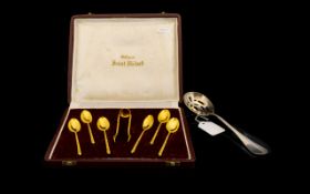 Silver Slotted Spoon & Cased set of Gilt Spoons & Sugar Tongs.