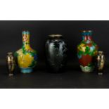 Two Oriental Cloisonne Vases Each decorated with traditional floral and foliate designs with