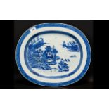 A 19th Century Oriental Oval Charger Large blue and white charger depicting pagodas and mountainous