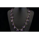A Vintage Amethyst Necklace Long pewter tone necklace set with multiple, organic form polished