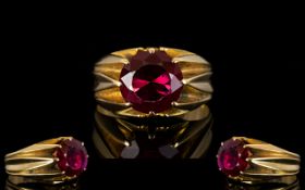 An Unmarked 18ct Gold And Ruby Ring Mounted with a blood red ruby coloured gemstone, est weight, 3.