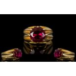 An Unmarked 18ct Gold And Ruby Ring Mounted with a blood red ruby coloured gemstone, est weight, 3.