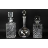 Three Attractive Glass Decanters. Tallest Twelve Inches. All With Star burst Designs To Bottom.