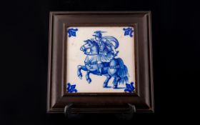 18th Century Dutch Tile Depicting a man on horseback in wood frame,