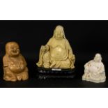 A Collection Of Modern Buddha Figures The tallest, 8 inches, comprising two resin figures, one