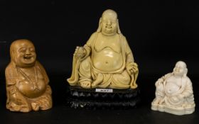 A Collection Of Modern Buddha Figures The tallest, 8 inches, comprising two resin figures, one