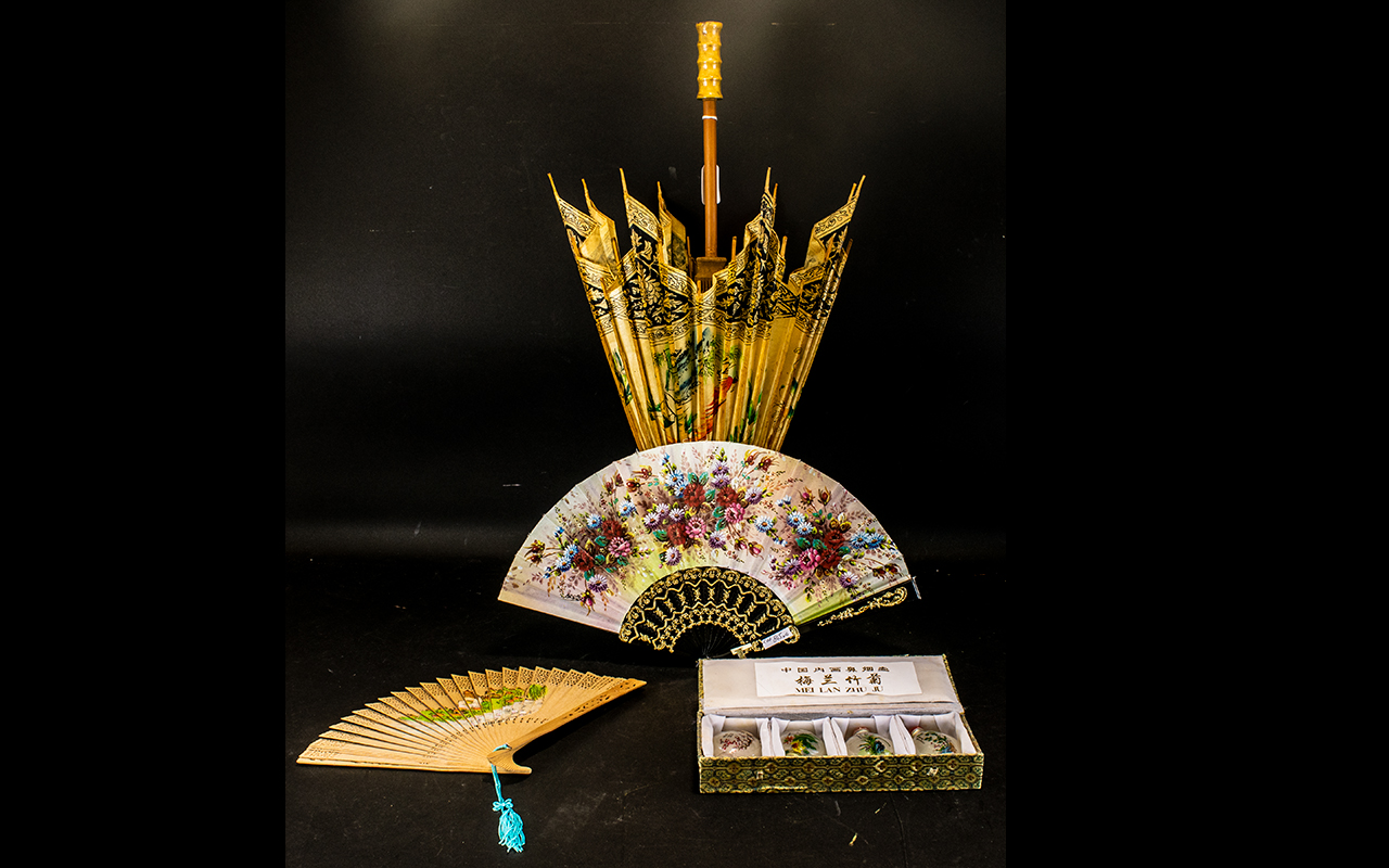 A Small Collection Of Oriental Items To include an early 20th century paper parasol with hand