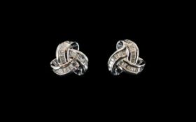 Diamond Love Knot Stud Earrings, triple knots, channel set with baguette cut diamonds, totalling .