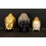 Three Modern Buddha Heads To include gilt and mirrored wall mask,