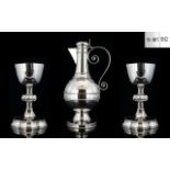 A Magnificent Late 19th Century Solid Silver Claret Jug and Matching Pair of Silver Chalices with