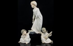 Lladro A Pair Of Cherub Figures The first in pensive pose, the second, playing a lute. Along with