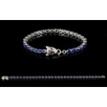 Sapphire Tennis Bracelet with Leopard Head Clasp, 15cts of oval cut blue sapphires in a single line,